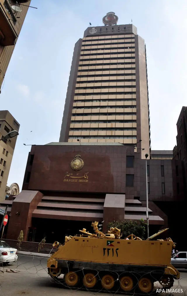 Armored vehicles are seen in front of an Egyptian bank in Cairo, Egypt on Feb 17,2011. Mubarak's departure set off a chain reaction around the Middle East, with anti-government demonstrations reported Wednesday in Libya,...