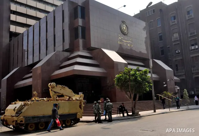 Armored vehicles are seen in front of an Egyptian bank in Cairo, Egypt on Feb 17,2011. Mubarak's departure set off a chain reaction around the Middle East, with anti-government demonstrations reported Wednesday in Libya,...