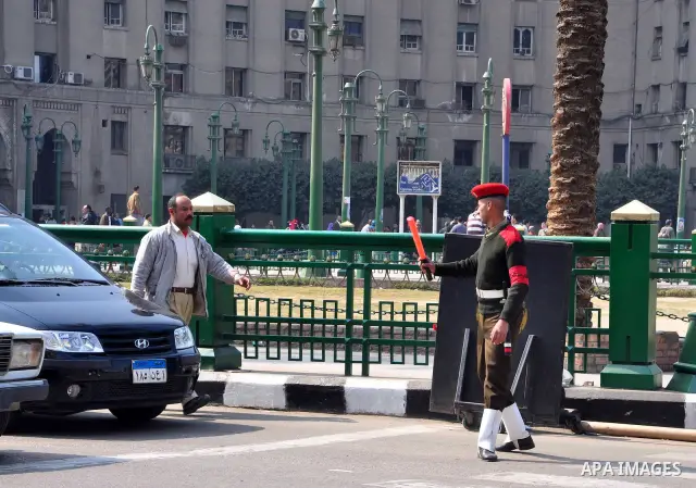 Egyptian people participate in their daily life in Cairo, Egypt on Feb. 17,2011. Mubarak's departure set off a chain reaction around the Middle East, with anti-government demonstrations reported Wednesday in Libya, Bahra...