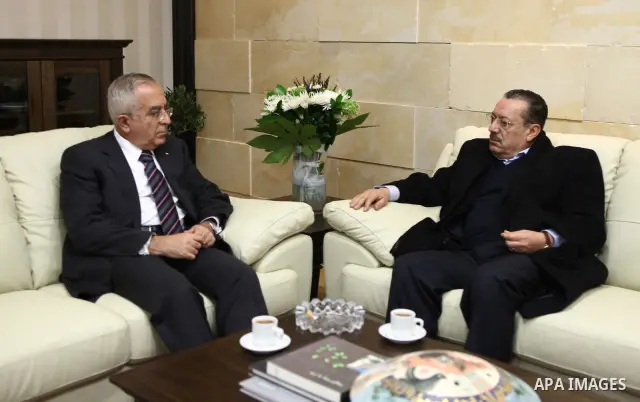 Palestinian prime minister Salam Fayyad (L) meets with secretary-general of the Palestinian Arab Front, Jamil Shehadeh (R), in the West Bank City of Ramallah on Feb. 17, 2011. Photo by Mustafa Abu Dayeh