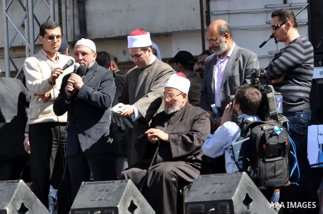 Egyptian cleric Sheik Youssef el-Qaradawi leads Friday prayers in Tahrir Square in Cairo, Egypt, Friday Feb. 18, 2011. Tens of thousands of flag-waving Egyptians packed into Tahrir Square for a day of prayer and celebrat...