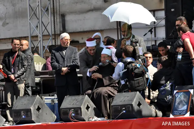Egyptian cleric Sheik Youssef el-Qaradawi leads Friday prayers in Tahrir Square in Cairo, Egypt, Friday Feb. 18, 2011. Tens of thousands of flag-waving Egyptians packed into Tahrir Square for a day of prayer and celebrat...