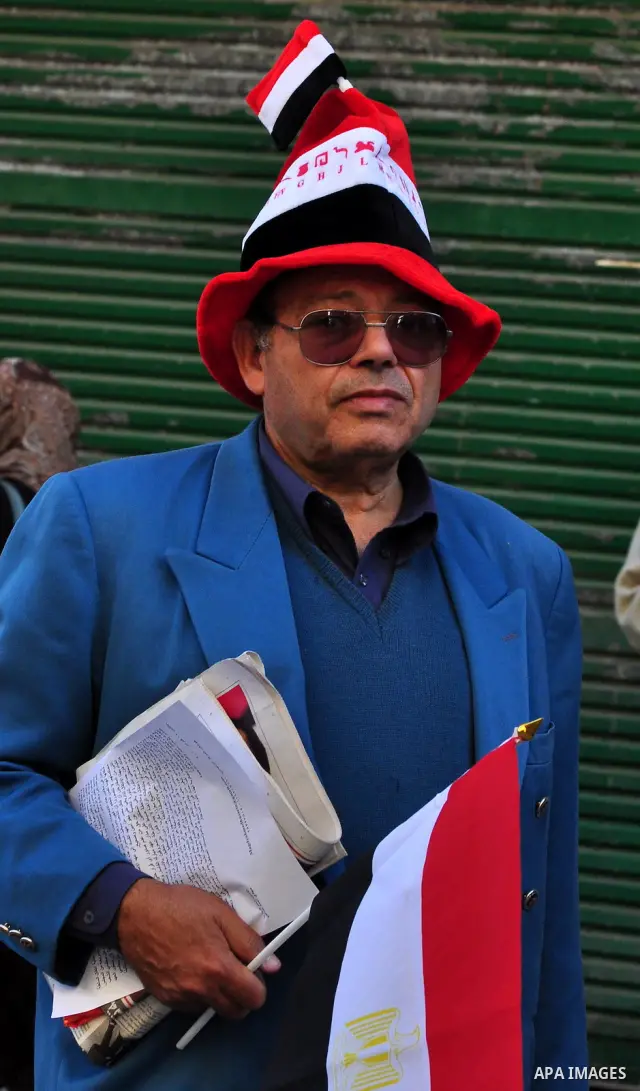 An Egyptian man attends a march at Tahrir Square in Cairo, Egypt, Feb. 18, 2011. Tens of thousands of flag-waving Egyptians packed into Tahrir Square for a day of prayer and celebration Friday to mark the fall of Hosni M...