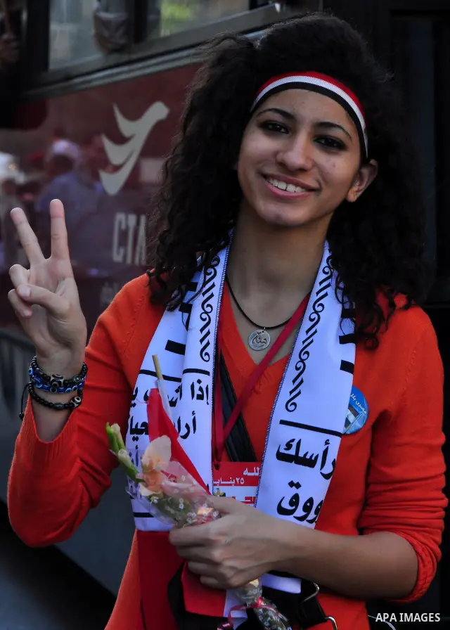 An Egyptian woman attends a march at Tahrir Square in Cairo, Egypt, Feb. 18, 2011. Tens of thousands of flag-waving Egyptians packed into Tahrir Square for a day of prayer and celebration Friday to mark the fall of Hosni...