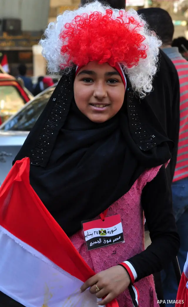An Egyptian woman attends a march at Tahrir Square in Cairo, Egypt, Feb. 18, 2011. Tens of thousands of flag-waving Egyptians packed into Tahrir Square for a day of prayer and celebration Friday to mark the fall of Hosni...