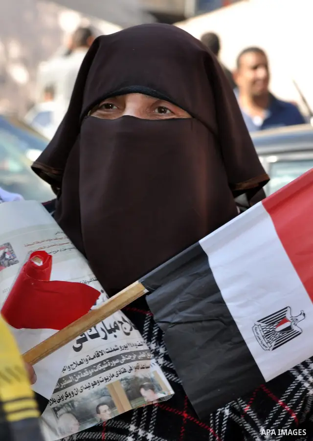 An Egyptian woman attends a march at Tahrir Square in Cairo, Egypt, Feb. 18, 2011. Tens of thousands of flag-waving Egyptians packed into Tahrir Square for a day of prayer and celebration Friday to mark the fall of Hosni...