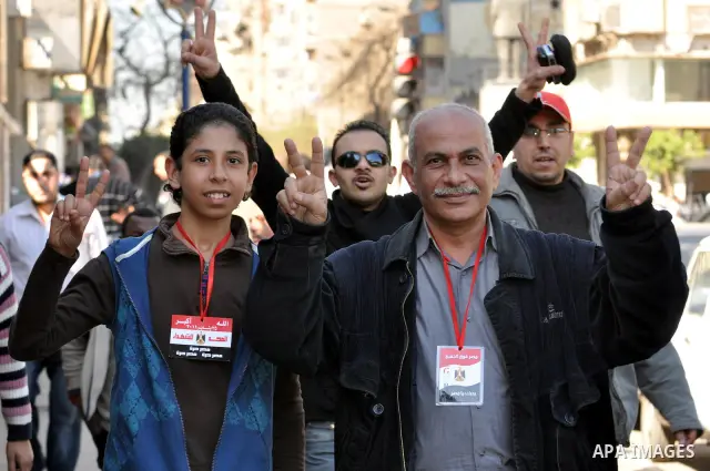 Egyptians attend a march at Tahrir Square in Cairo, Egypt, Feb. 18, 2011. Tens of thousands of flag-waving Egyptians packed into Tahrir Square for a day of prayer and celebration Friday to mark the fall of Hosni Mubarak...