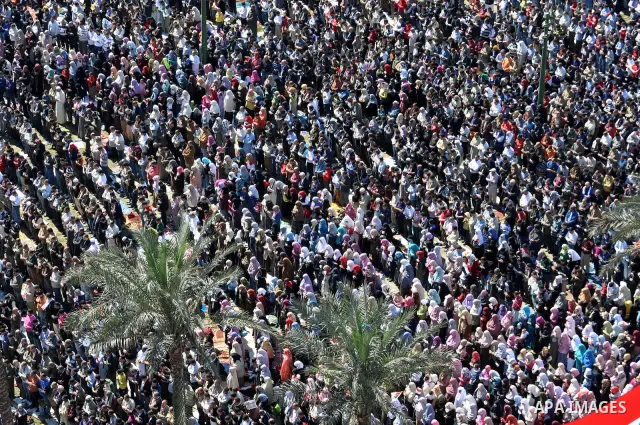 Thousands attend Friday prayers and a demonstration in Tahrir Square in Cairo, Egypt, Friday Feb. 18, 2011. Tens of thousands of flag-waving Egyptians packed into Tahrir Square for a day of prayer and celebration Friday...