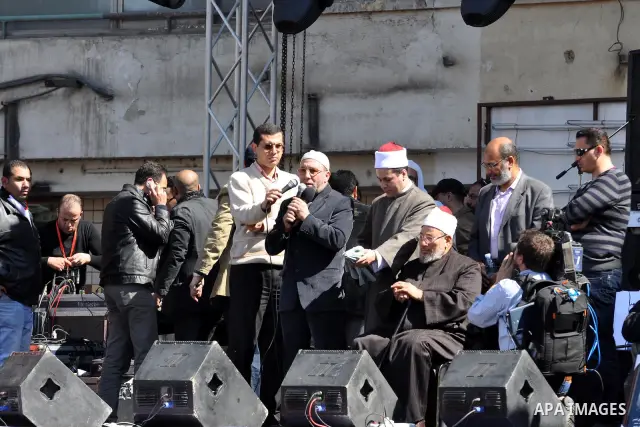 Egyptian cleric Sheik Youssef el-Qaradawi leads Friday prayers in Tahrir Square in Cairo, Egypt, Friday Feb. 18, 2011. Tens of thousands of flag-waving Egyptians packed into Tahrir Square for a day of prayer and celebrat...