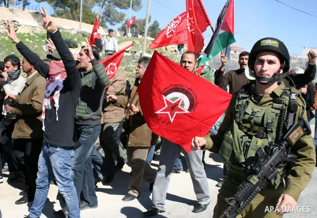 Palestinian, Israeli and International protesters take part in a demonstration against Israel's controversial separation barrier in the West Bank village of Maasarah, near the biblical town of Bethlehem on 18 February 20...