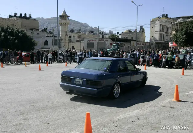 A Palestinian driver takes part in car race in the West Bank city of Nablus, Friday, Feb, 18, 2011. Photo by Wagdi Eshtayah