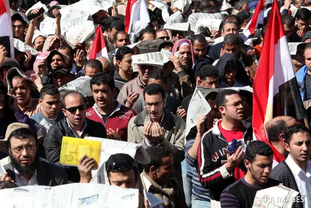 Thousands attend Friday prayers and a demonstration in Tahrir Square in Cairo, Egypt, Friday Feb. 18, 2011. Tens of thousands of flag-waving Egyptians packed into Tahrir Square for a day of prayer and celebration Friday...
