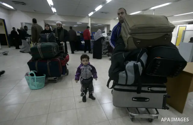 Palestinians Leaving the Hall travelers after coming back from Egypt at the Rafah border crossing between southern Gaza Strip and Egypt, Friday, Feb. 18, 2011. The Rafah border crossing opened on Friday evening for the f...