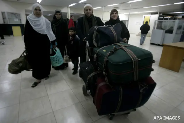 Palestinians Leaving the Hall travelers after coming back from Egypt at the Rafah border crossing between southern Gaza Strip and Egypt, Friday, Feb. 18, 2011. The Rafah border crossing opened on Friday evening for the f...