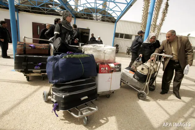Palestinians returning from Egypt cross through the Rafah crossing on Feb. 19, 2011. The Egyptian authorities reopened the Rafah crossing on its border with the Gaza Stripe on Friday, the first time after the resignation...