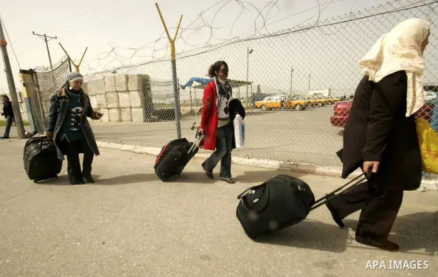 Palestinians returning from Egypt cross through the Rafah crossing on Feb. 19, 2011. The Egyptian authorities reopened the Rafah crossing on its border with the Gaza Stripe on Friday, the first time after the resignation...