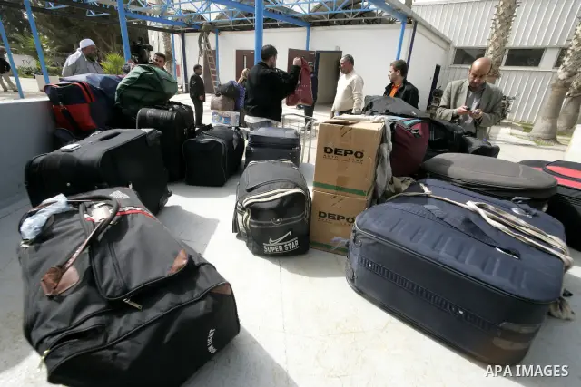 Palestinians returning from Egypt cross through the Rafah crossing on Feb. 19, 2011. The Egyptian authorities reopened the Rafah crossing on its border with the Gaza Stripe on Friday, the first time after the resignation...