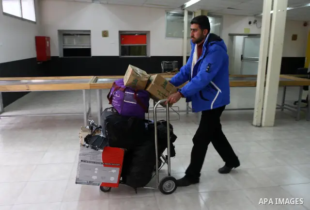 Palestinians returning from Egypt cross through the Rafah crossing on Feb. 19, 2011. The Egyptian authorities reopened the Rafah crossing on its border with the Gaza Stripe on Friday, the first time after the resignation...