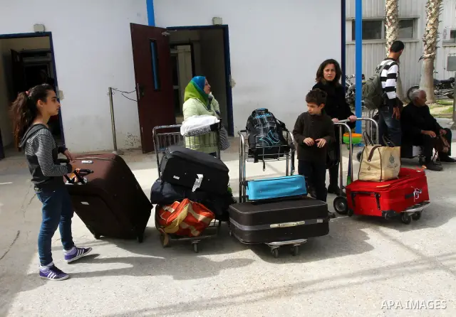 Palestinians returning from Egypt cross through the Rafah crossing on Feb. 19, 2011. The Egyptian authorities reopened the Rafah crossing on its border with the Gaza Stripe on Friday, the first time after the resignation...