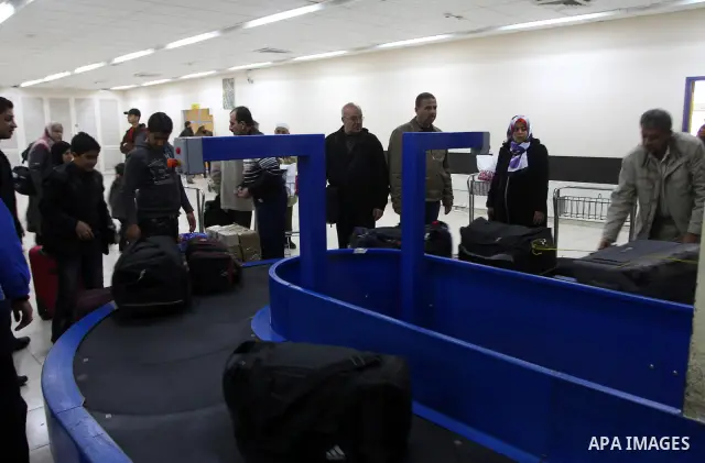 Palestinians returning from Egypt cross through the Rafah crossing on Feb. 19, 2011. The Egyptian authorities reopened the Rafah crossing on its border with the Gaza Stripe on Friday, the first time after the resignation...