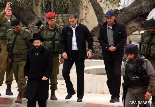 An Israeli Jewish rabbi walks at the entrance of the tomb of the Biblical figure Yehoshua Bin Nun, also know as Joshua, in the West Bank village of Kifl Hareth, near Nablus, Sunday, Feb 20,2011. Photo by Wagdi Eshtayah