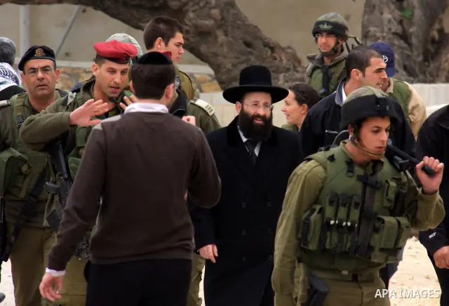 An Israeli Jewish rabbi walks at the entrance of the tomb of the Biblical figure Yehoshua Bin Nun, also know as Joshua, in the West Bank village of Kifl Hareth, near Nablus, Sunday, Feb 20,2011. Photo by Wagdi Eshtayah