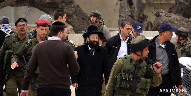 An Israeli Jewish rabbi walks at the entrance of the tomb of the Biblical figure Yehoshua Bin Nun, also know as Joshua, in the West Bank village of Kifl Hareth, near Nablus, Sunday, Feb 20,2011. Photo by Wagdi Eshtayah