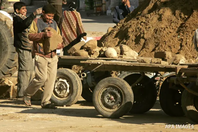 Palestinian children extract the stone from the sand, To re-manufacture a new block in the Rafah refugee camp southern Gaza Strip on February 21, 2011. Because of the Israeli siege and closure of the crossings and preven...