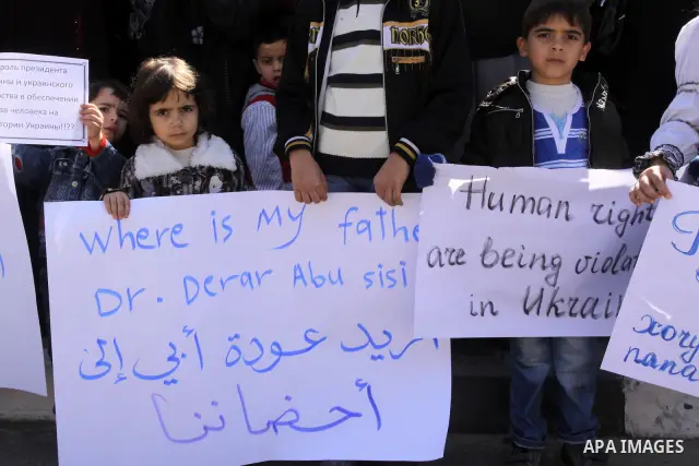 Palestinian children demonstrate during a protest to show solidarity with Derar Abu Sissi family, Who was kidnapped by an unidentified people in Ukraine, in front of Red Cross building, Gaza City on Feb. 22, 2011. Photo...