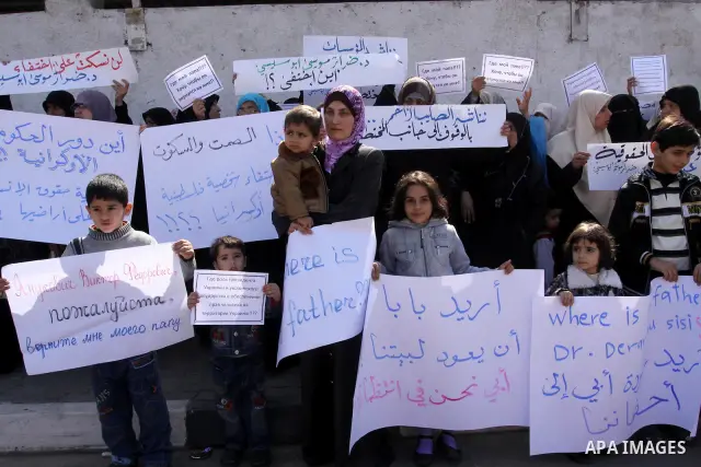 Palestinians demonstrate during a protest to show solidarity with Derar Abu Sissi family, who was kidnapped by an unidentified people in Ukraine, in front of Red Cross building, Gaza City on Feb. 22, 2011. Photo by Moham...