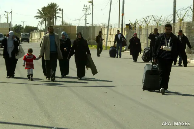 Palestinians arrive to the Gaza Strip through the Rafah border crossing with Egypt, in southern Gaza, on February 22, 2011 after it was opened for passage for people leaving and entering the Palestinian enclave. Photo by...