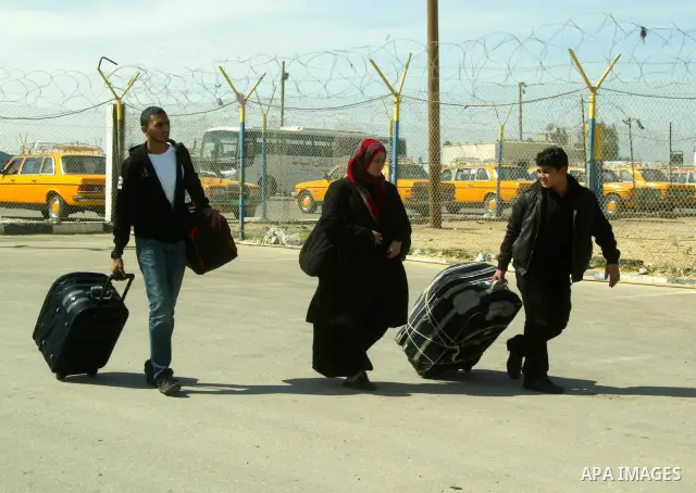 Palestinians arrive to the Gaza Strip through the Rafah border crossing with Egypt, in southern Gaza, on February 22, 2011 after it was opened for passage for people leaving and entering the Palestinian enclave. Photo by...