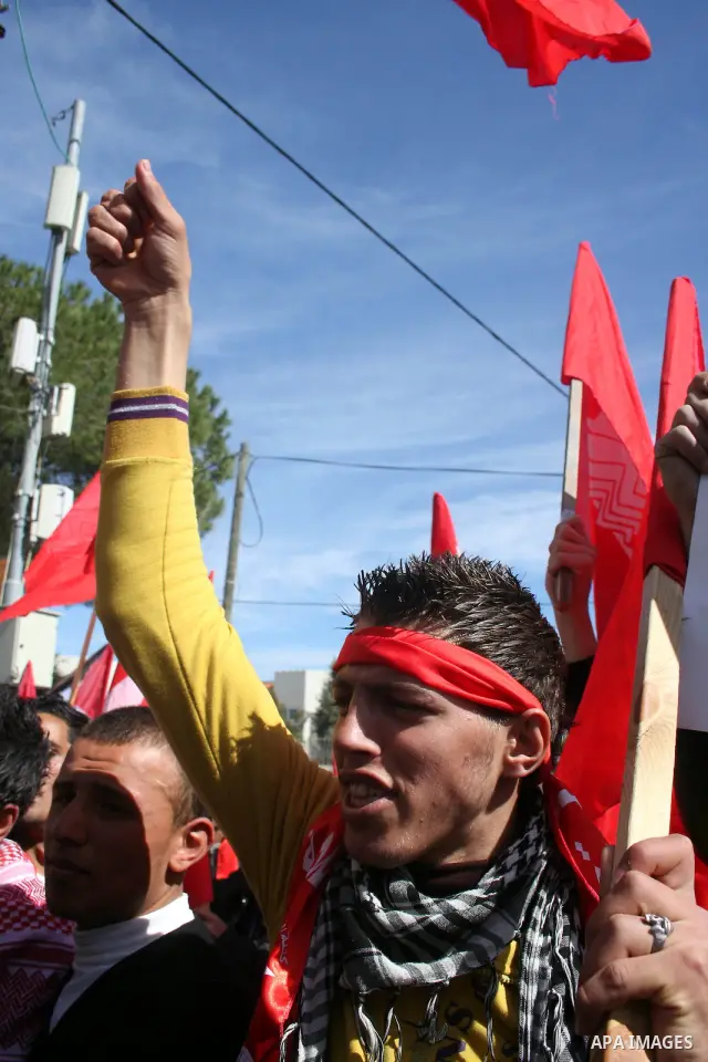 Palestinian universities students take part in a protest calling for the adoption of the National Fund for Education in the West Bank city of Ramallah on Feb. 22,2011. Photo by Issam Rimawi