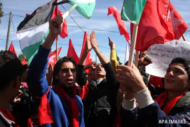 Palestinian universities students take part in a protest calling for the adoption of the National Fund for Education in the West Bank city of Ramallah on Feb. 22,2011. Photo by Issam Rimawi