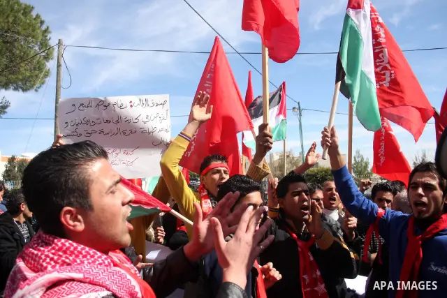 Palestinian universities students take part in a protest calling for the adoption of the National Fund for Education in the West Bank city of Ramallah on Feb. 22,2011. Photo by Issam Rimawi