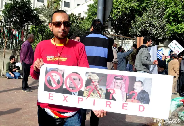 Protesters take part in a protest against Libyan Leader Moammar Gadhafi in front of the Arab league in Cairo, Egypt, Feb. 22, 2011. Protesters gathered at the protest against Gadhafi's crackdown on peaceful protesters in...
