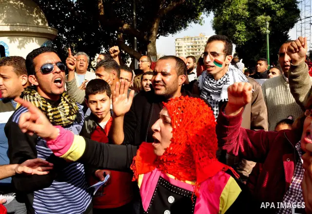 Protesters take part in a protest against Libyan Leader Moammar Gadhafi in front of the Arab league in Cairo, Egypt, Feb. 22, 2011. Protesters gathered at the protest against Gadhafi's crackdown on peaceful protesters in...