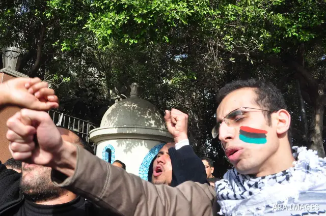 Protesters take part in a protest against Libyan Leader Moammar Gadhafi in front of the Arab league in Cairo, Egypt, Feb. 22, 2011. Protesters gathered at the protest against Gadhafi's crackdown on peaceful protesters in...