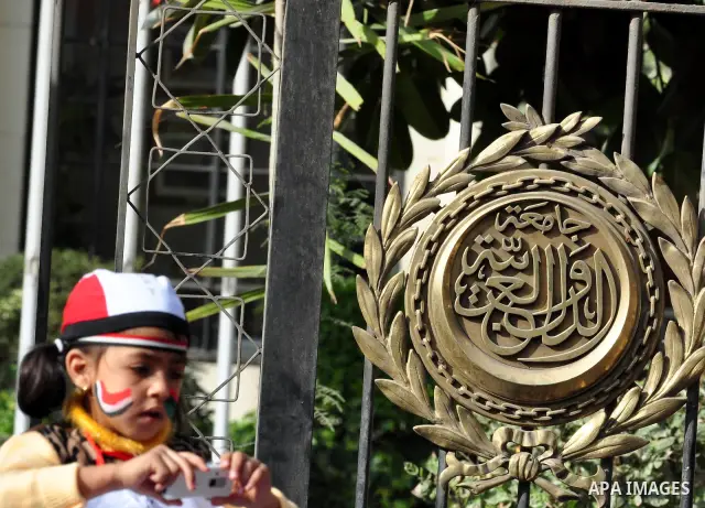 Protesters take part in a protest against Libyan Leader Moammar Gadhafi in front of the Arab league in Cairo, Egypt, Feb. 22, 2011. Protesters gathered at the protest against Gadhafi's crackdown on peaceful protesters in...