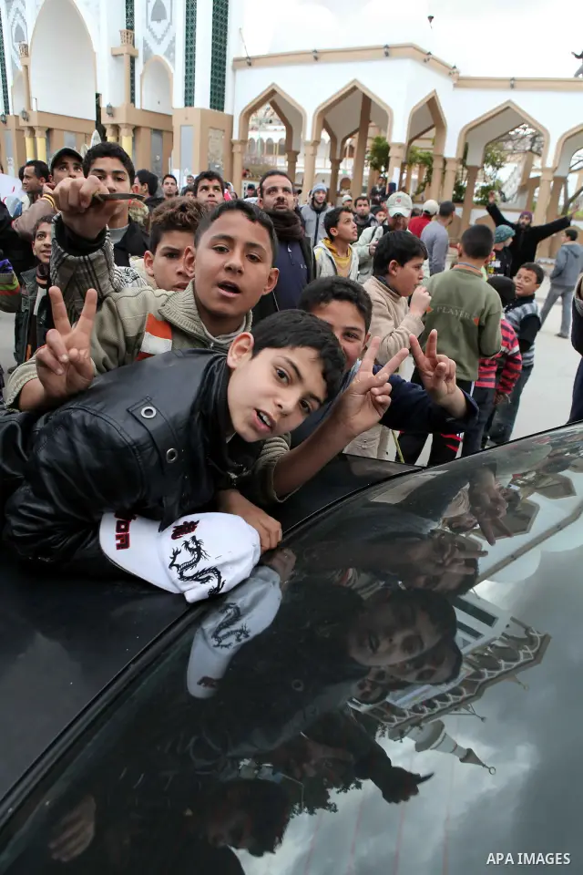 People attend a protest in the eastern Libyan town of Derna on Feb. 23, 2011. Unrest shook Libya in recent days as government crackdowns on protesters have resulted in mass casualties, according to human rights groups. P...