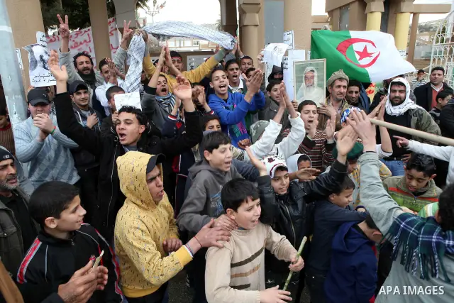 People attend a protest in the eastern Libyan town of Derna on Feb. 23, 2011. Unrest shook Libya in recent days as government crackdowns on protesters have resulted in mass casualties, according to human rights groups. P...