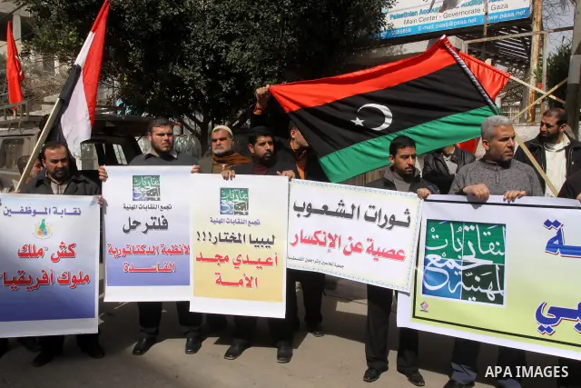 Palestinians take part in a protest to show solidarity with Libyan people, in Gaza city on Feb. 24, 2011. Photo by Mohammed Asad