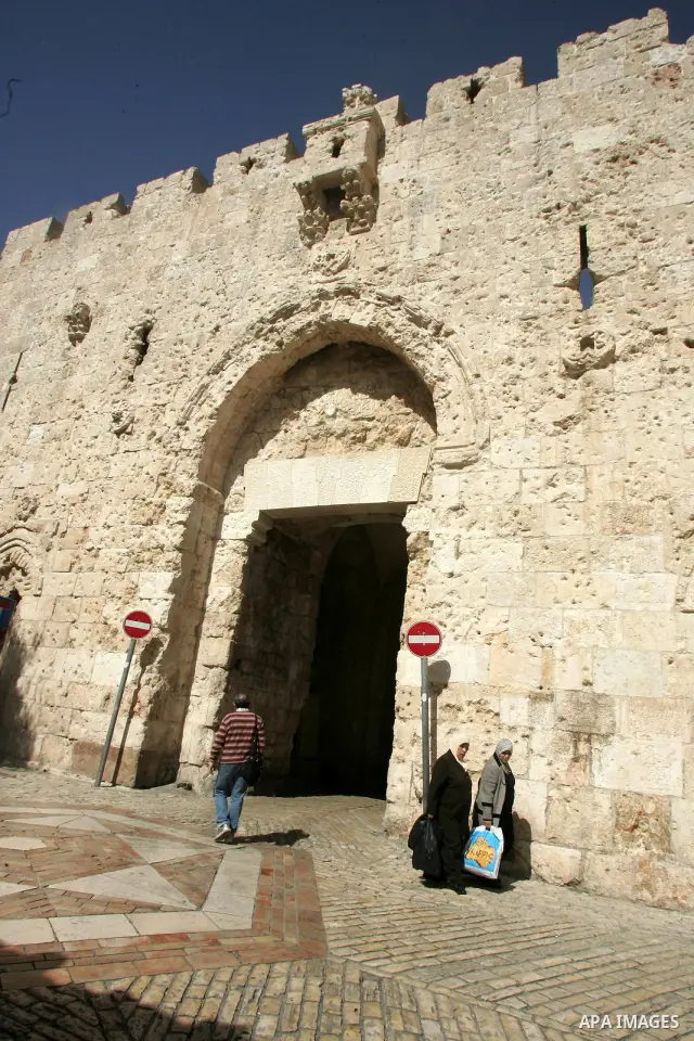 Palestinians walk past the David's gate, just outside Jerusalem's Old City on Feb. 24, 2011. Photo by Mahfouz Abu Turk
