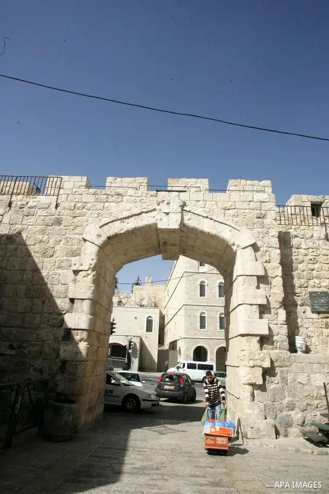 A Palestinian boy walks past the New gate as known to Palestinians "Bab al-Jedid", just outside Jerusalem's Old City on Feb. 24, 2011. Photo by Mahfouz Abu Turk