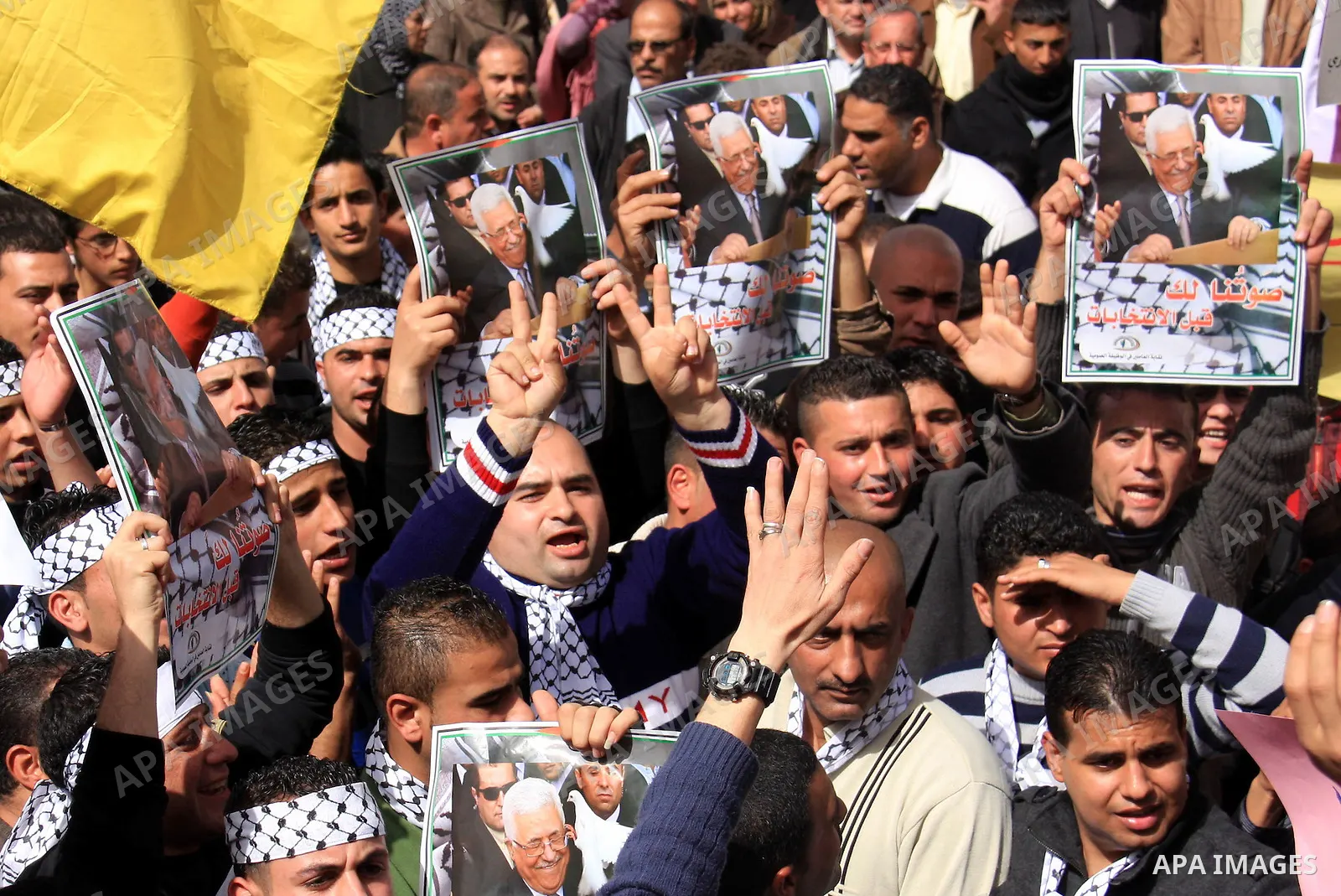 Palestinians hold placards of Palestinian President Mahmoud Abbas during a rally against the U.S. veto and calling for the national reconciliation in the West Bank city of Nablus, Thursday, Feb. 24, 2011. Photo by Wagdi...