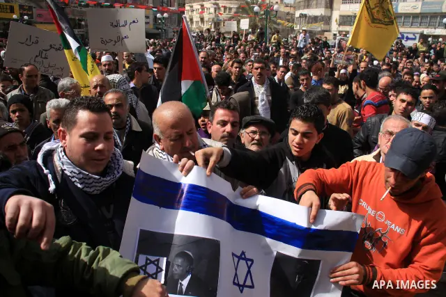 Palestinians take part in a rally against the U.S. veto and calling for the national reconciliation in the West Bank city of Nablus, Thursday, Feb. 24, 2011. Photo by Wagdi Eshtayah