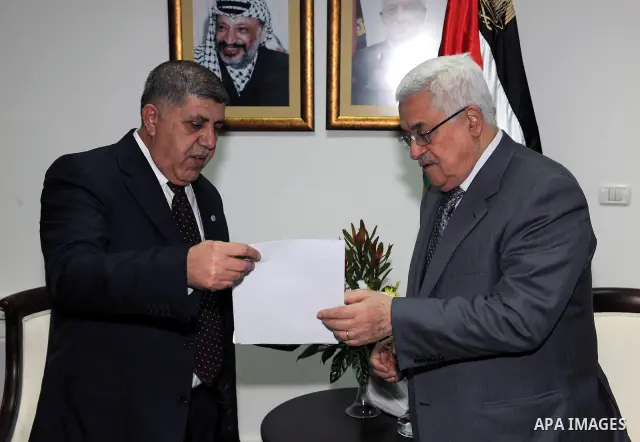Palestinian President Mahmoud Abbas receives the annual report of the council of administrative and financial control in the West bank city of Ramallah on Feb. 24, 2011. Photo by Thaer Ganaim
