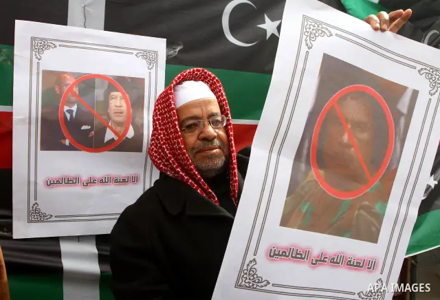 Palestinians take part in a protest to show solidarity with Libyan people, in Gaza city. Photo by Ashraf Amra