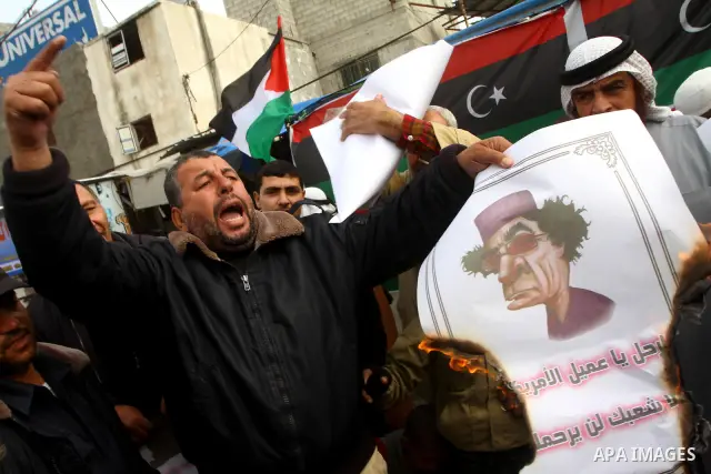 Palestinians take part in a protest to show solidarity with Libyan people, in Gaza city. Photo by Ashraf Amra