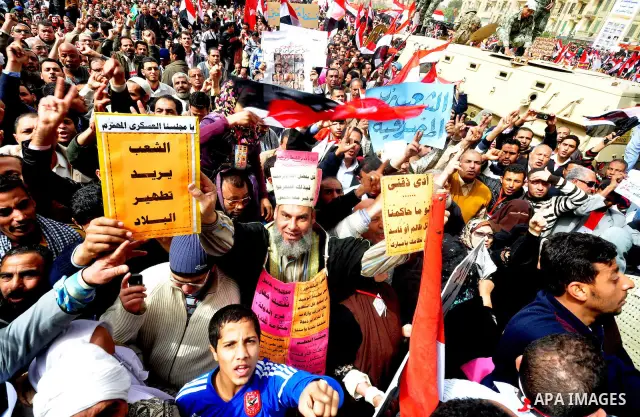 Egyptian protesters take part in a demonstration and Friday prayers in Tahrir Square, Cairo, Egypt, Friday, Feb. 25, 2011. Tens of thousands rallied in Cairo's Tahrir Square on Friday, trying to keep up pressure on Egypt...